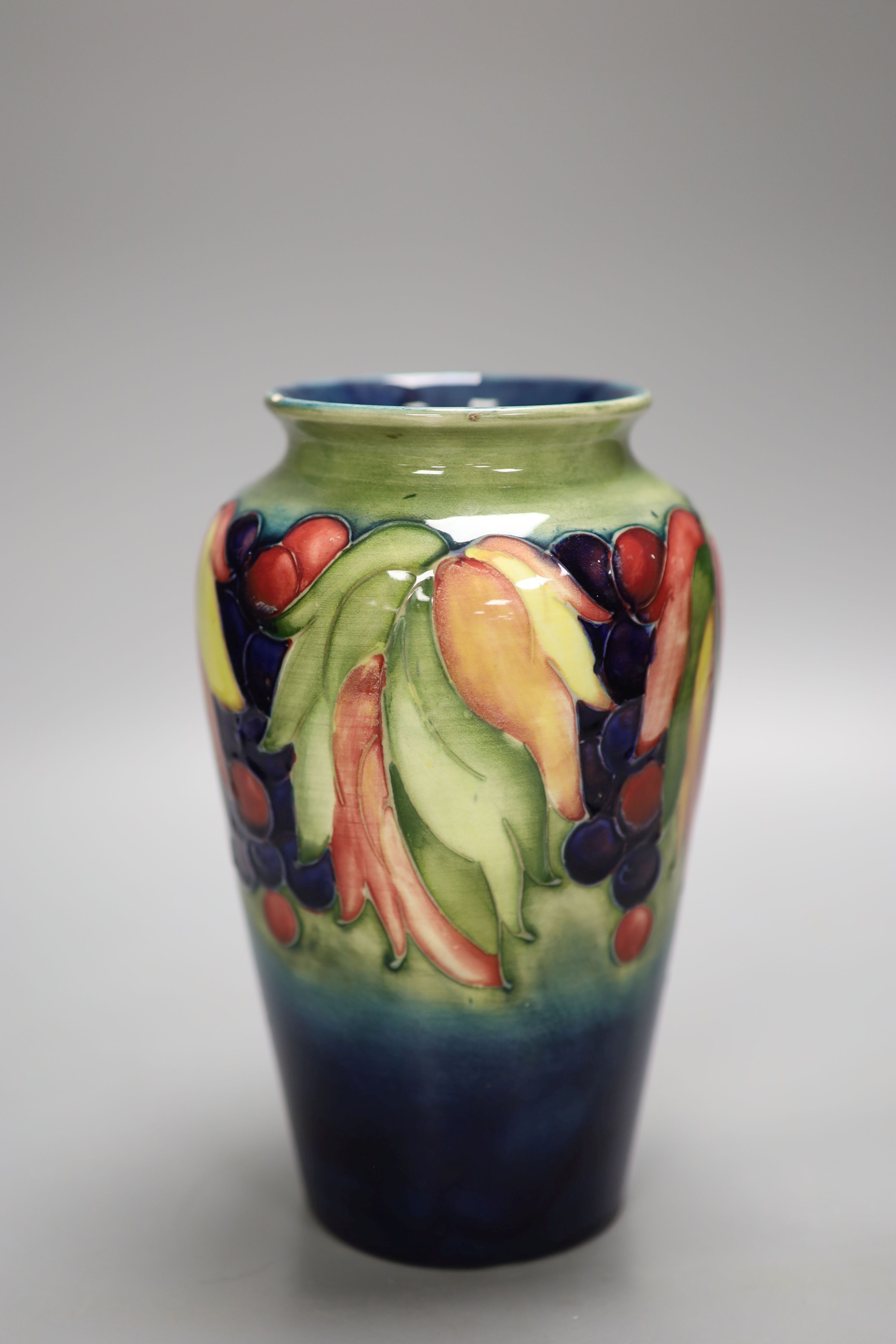 A Moorcroft leaf and berry vase, height 21cm